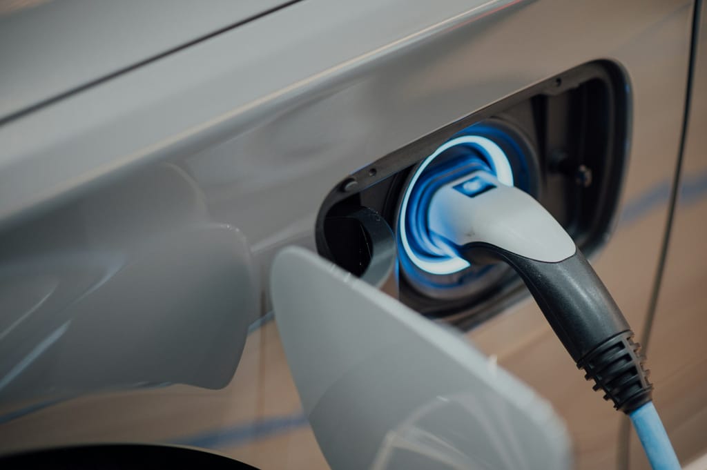 Electric vehicle charge point installed on a driveway wall