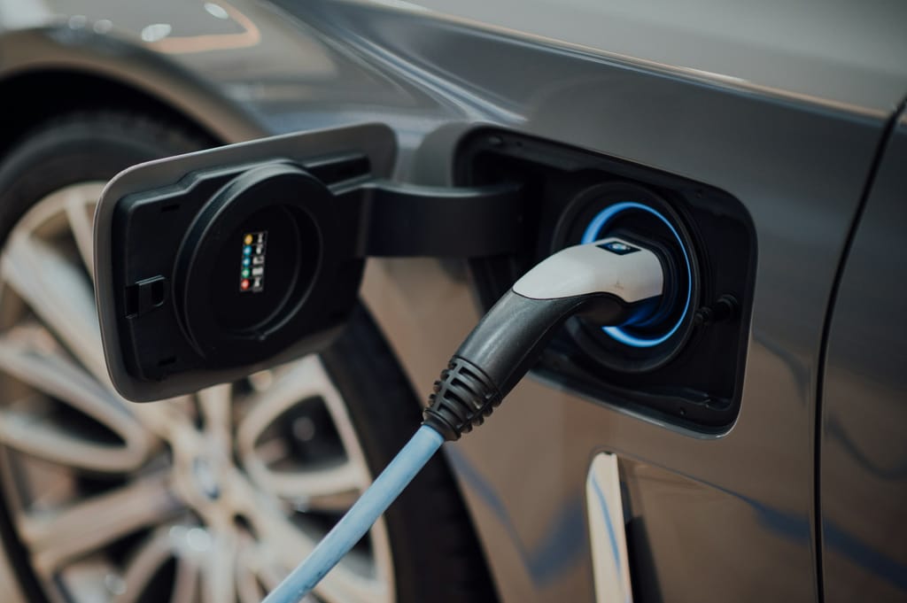 Electric vehicle charging point mounted on an exterior wall